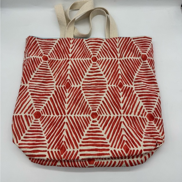 Arbonne Brand Tote Bag featuring geometric red and white pattern. - Picture 2 of 4